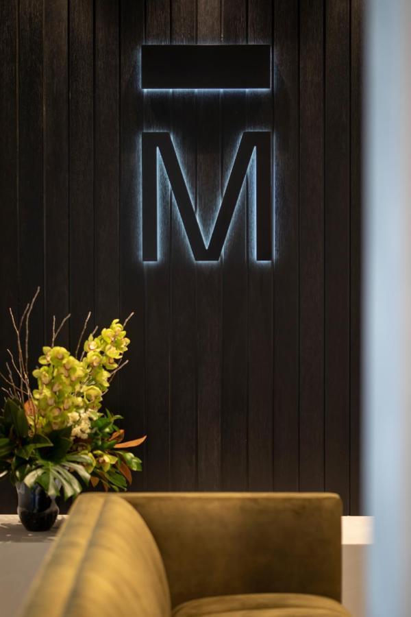 The Mayfair Christchurch Esterno foto The M on the wall of the lobby